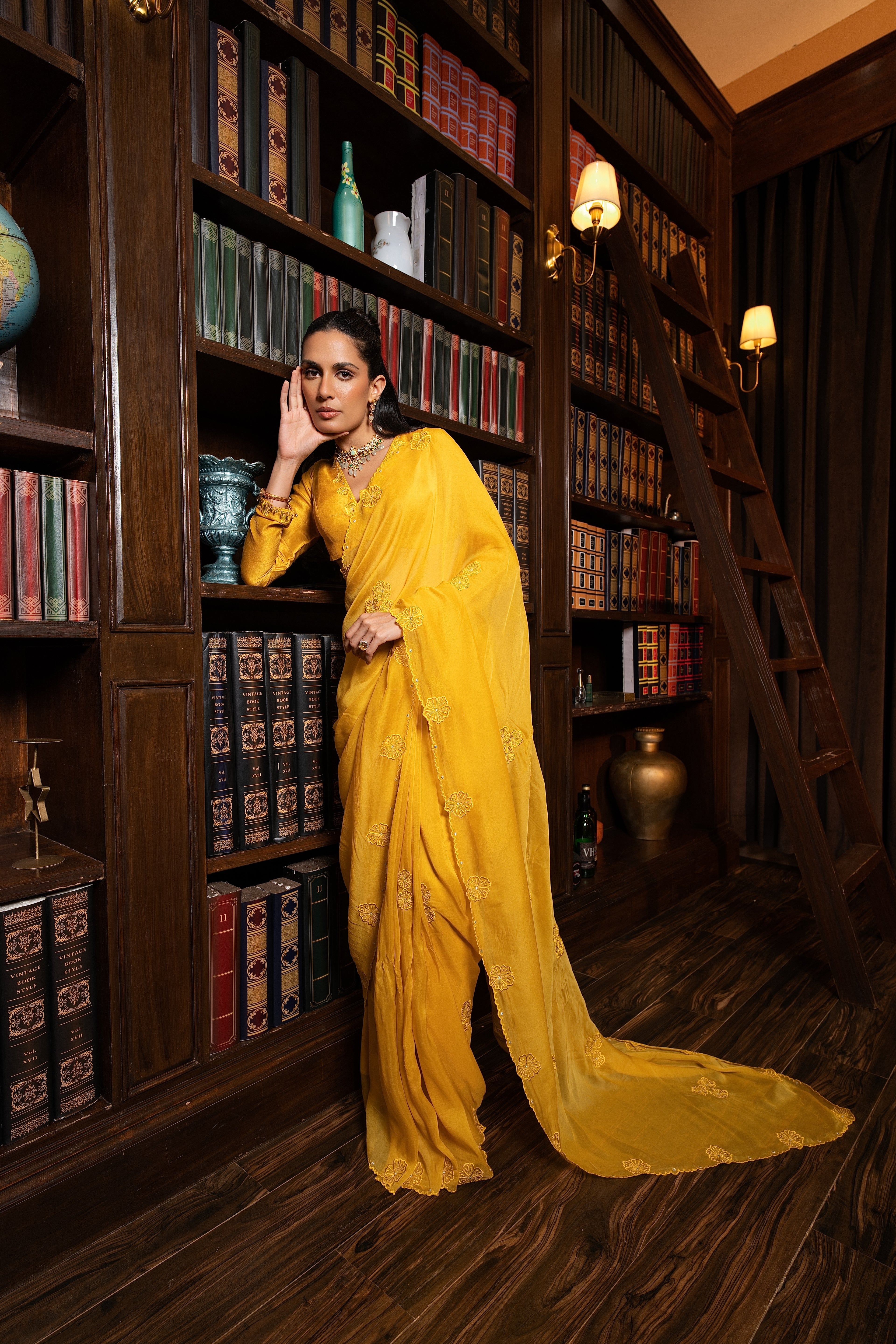 Golden yellow embriodered sari set .
