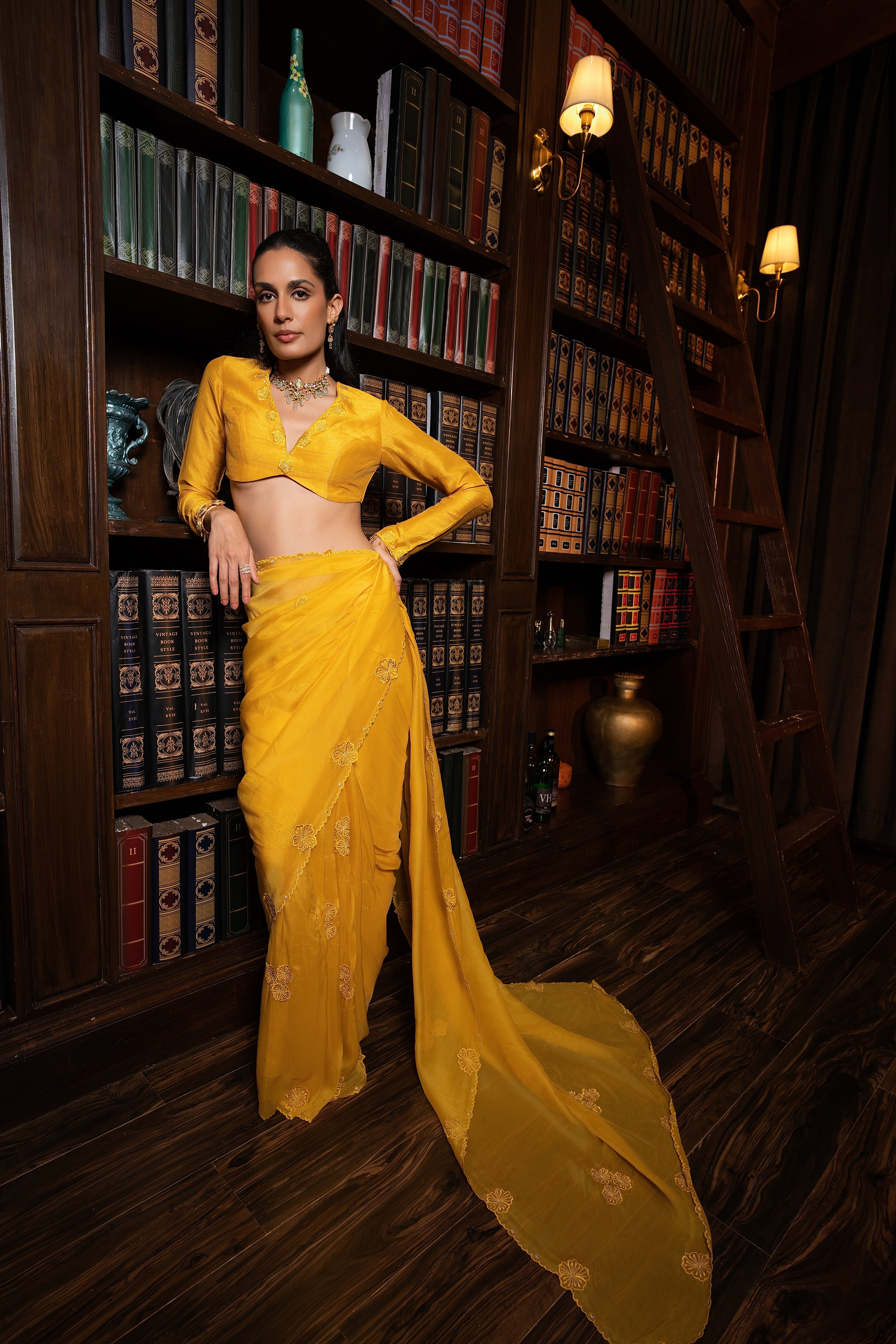 Golden yellow embriodered sari set .