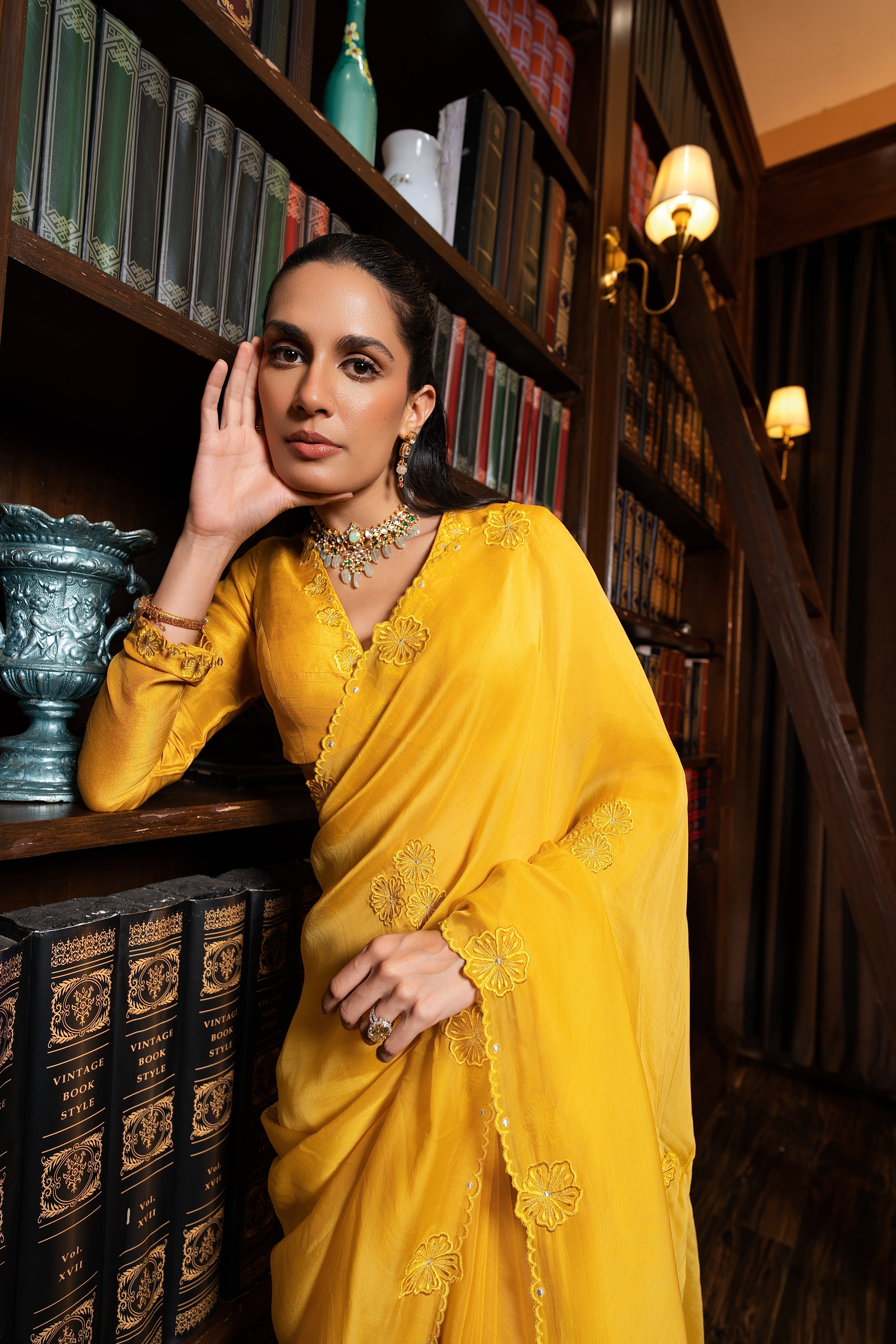 Golden yellow embriodered sari set .