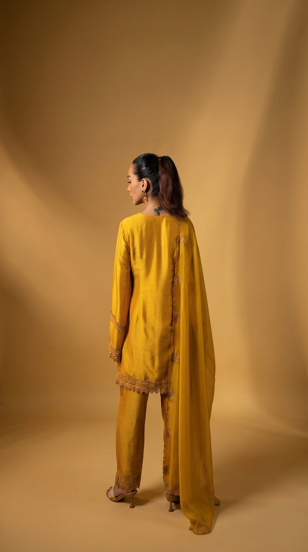 Sunshine yellow embriodered short kurta set.